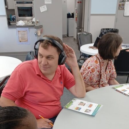 A Clubber working on functional literacy and math skills during a small group session