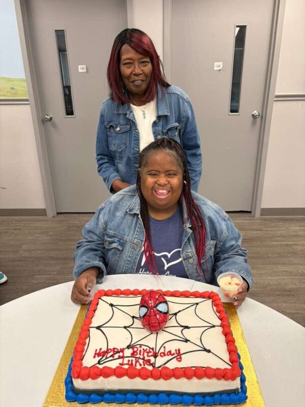 A clubber celebrating a birthday with a Spider-Man cake